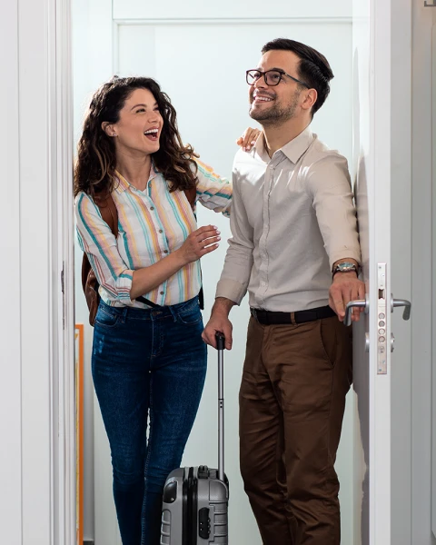 Couple moving into accommodation under the Price-Quality System (PKS)