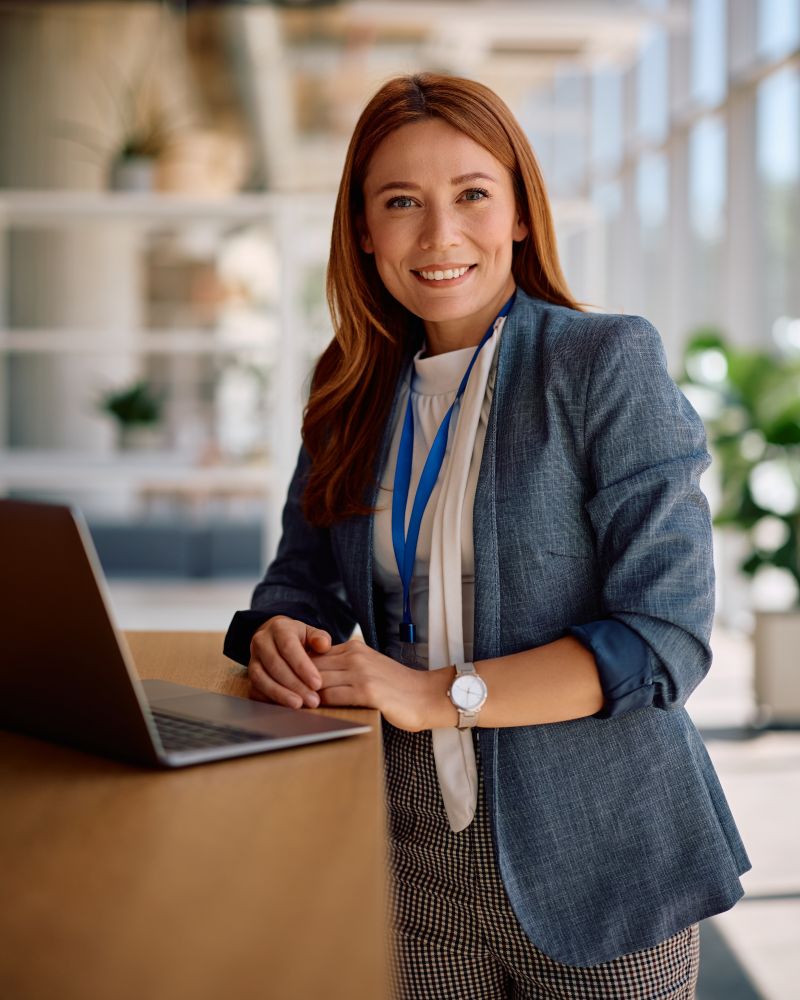 Sickness Absence Administrator working in a modern office setting.
